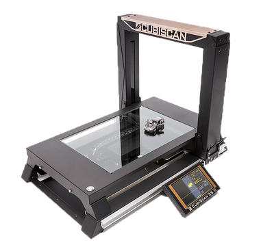A toy car is being measured on the CubiScan 25.